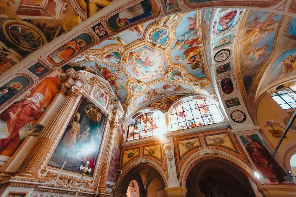 A painted and gilded vaulted ceiling, seen from below.