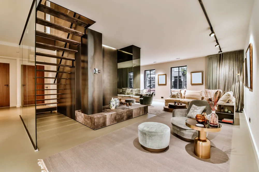 A contemporary living space with an open stair and low seating.